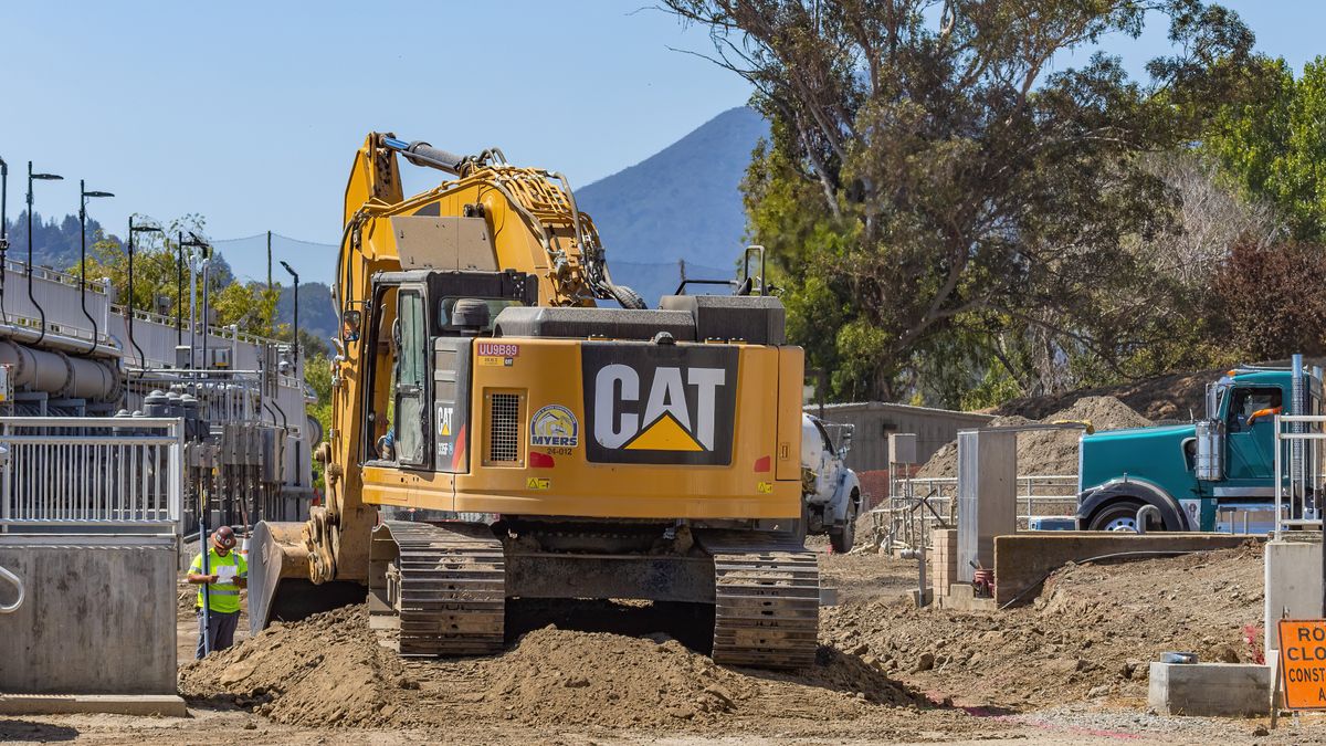 Caterpillar tracked excavator working on a construction site